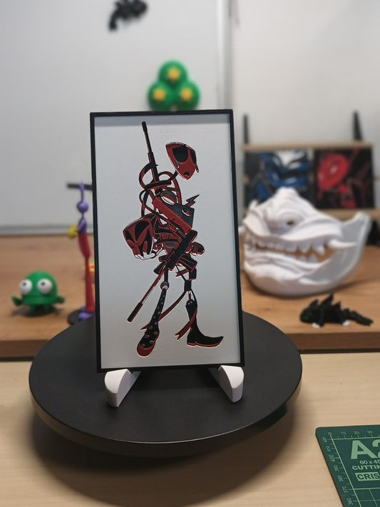 Cuadro 3D artesanal de Gangle y Zooble inspirado en The Amazing Digital Circus con relieve tridimensional y marco negro.