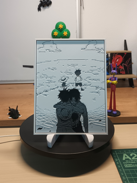 Cuadro 3D artesanal de Ace y Luffy en Marineford con marco blanco.
